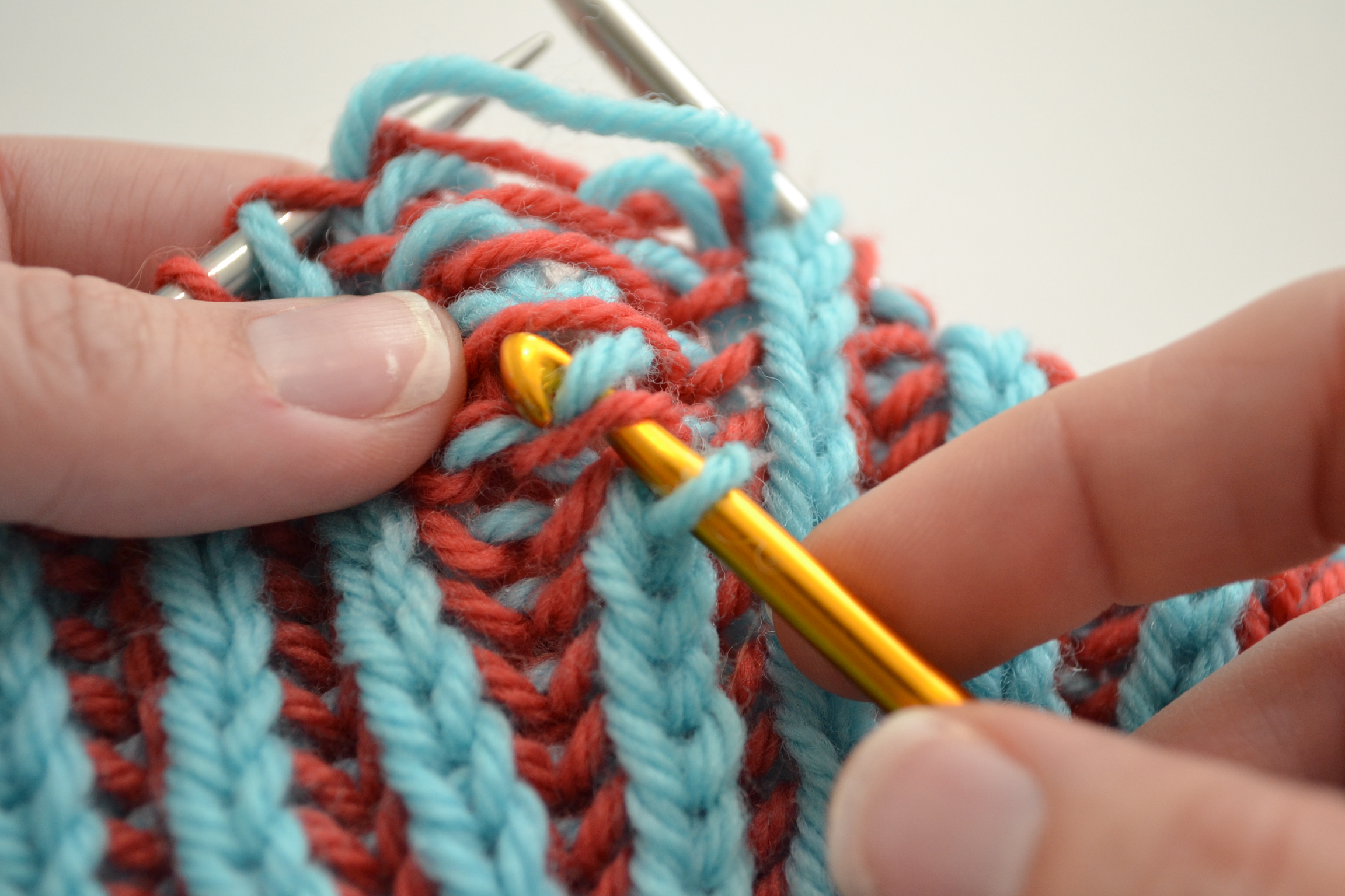 use a crochet hook to pick up dropped brioche stitches